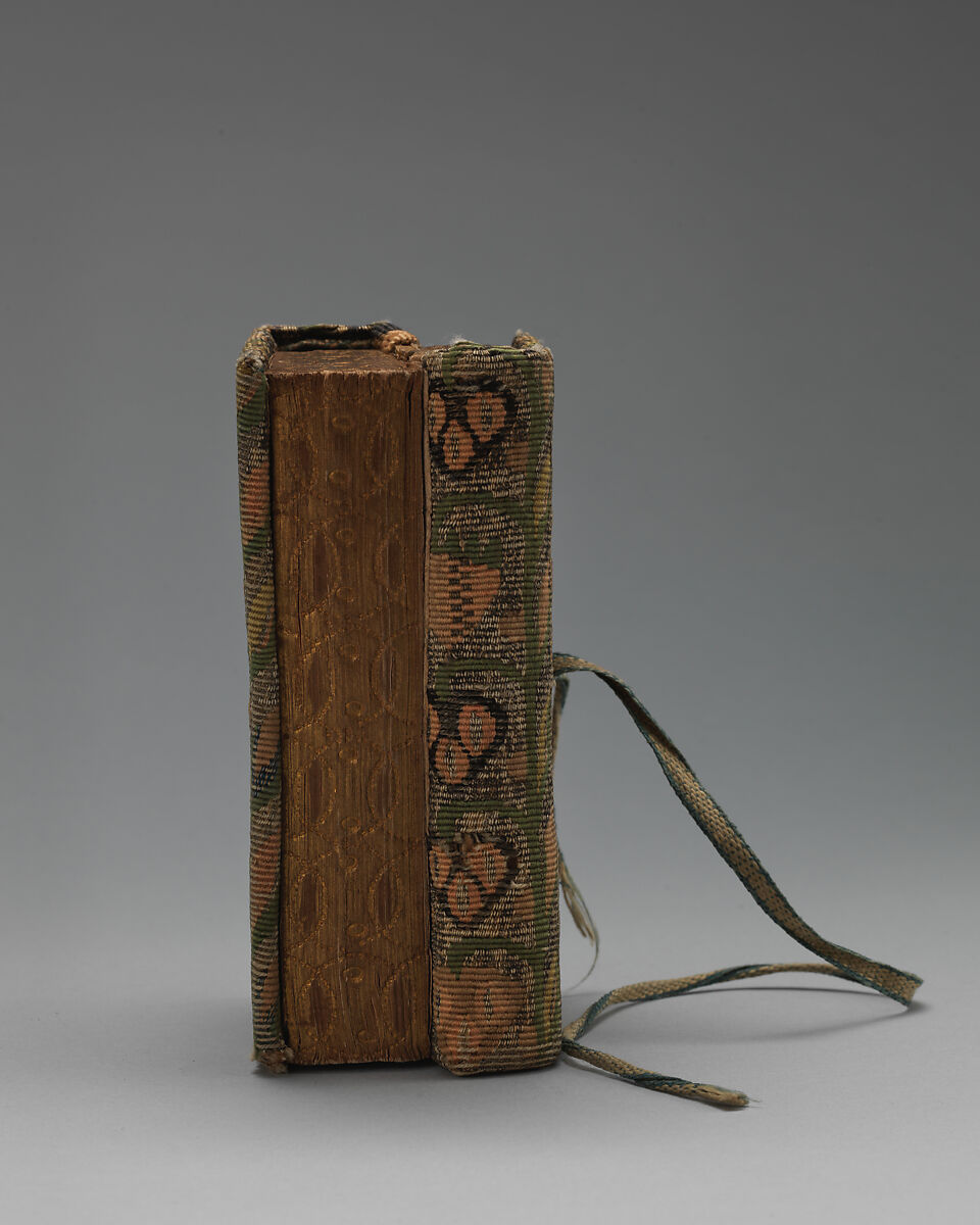 Bookbinding of repeat foliate pattern, Attributed to the weaving workshop funded by William Sheldon (Barcheston, Warwickshire and Bordesley, Worcestershire), Wool, silk, silver-metal-wrapped thread, containing a seventeenth-century printed book, British, possibly Barcheston or Bordesley