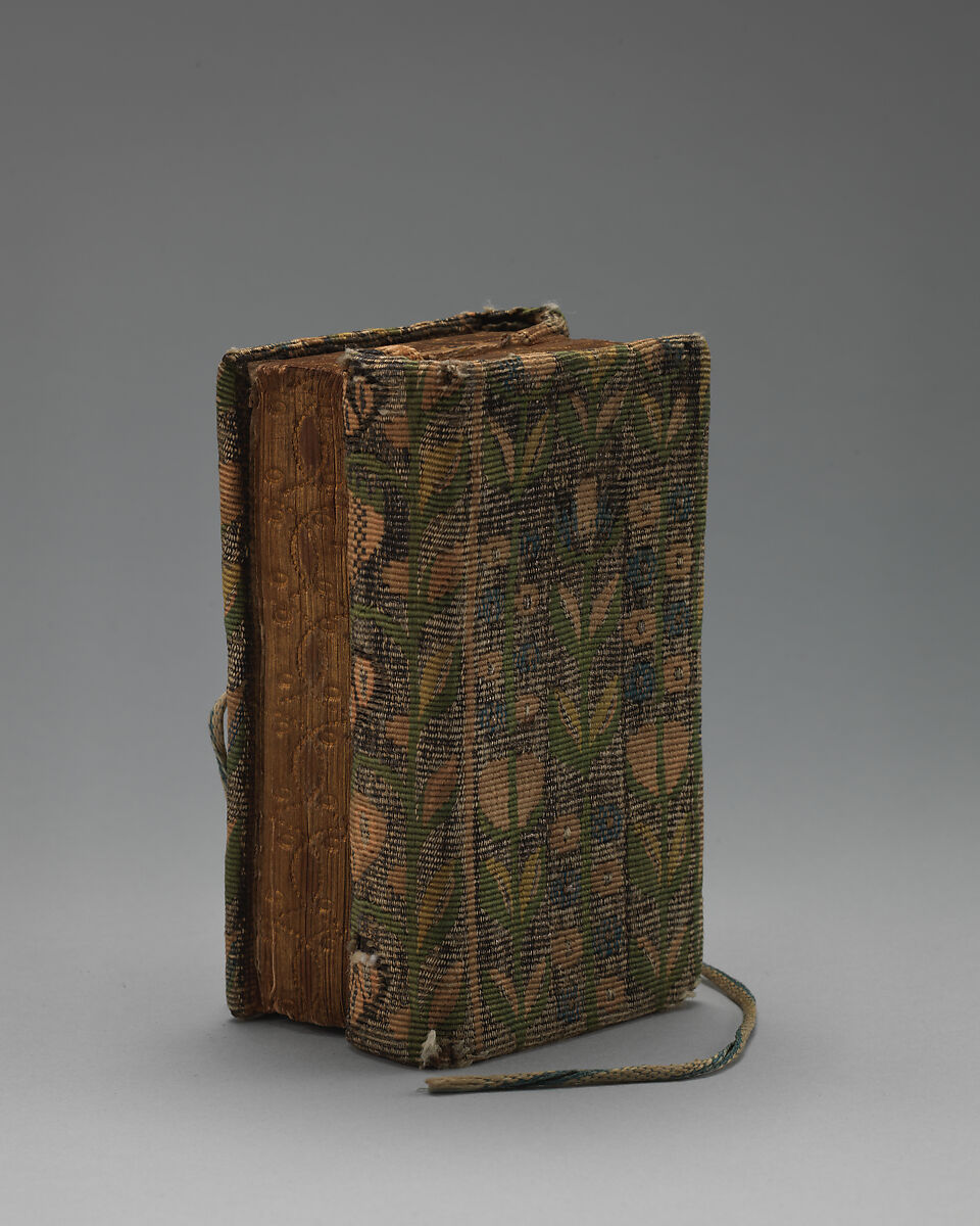 Bookbinding of repeat foliate pattern, Attributed to the weaving workshop funded by William Sheldon (Barcheston, Warwickshire and Bordesley, Worcestershire), Wool, silk, silver-metal-wrapped thread, containing a seventeenth-century printed book, British, possibly Barcheston or Bordesley