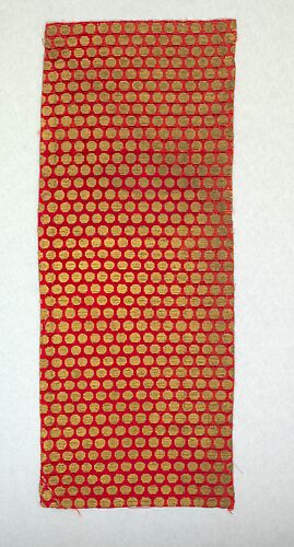Fragment of crimson velvet with gold octagonal disks