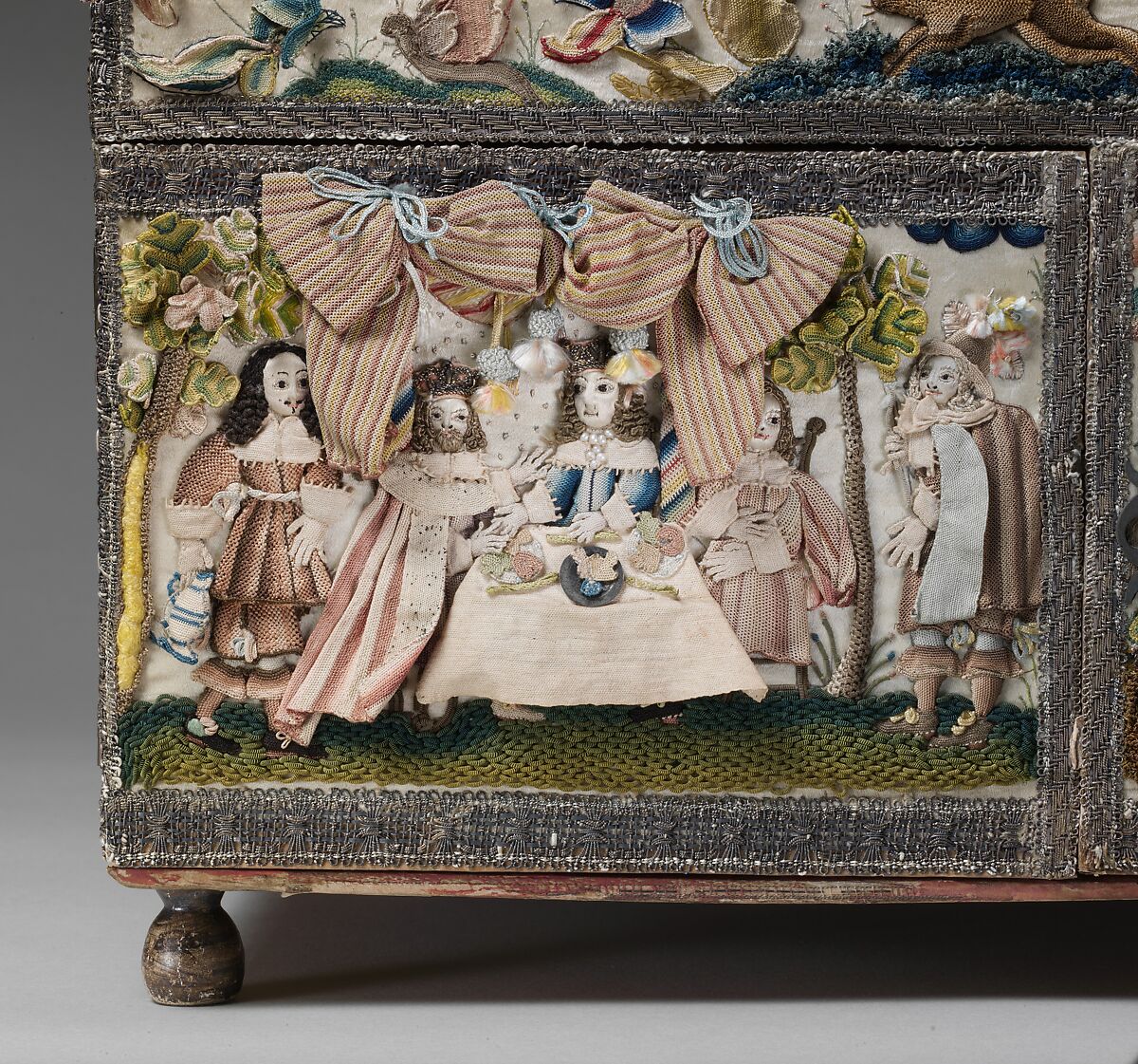 Cabinet with scenes from the Story of Esther, Wood; silk satin worked with silk, metal threads (metal strip wrapped silk, silk-wrapped coiled wire, wire) linen thread, seed pearls, mica, feathers; detached buttonhole, buttonhole filling variations; French knot, single knot, laid work, couching, satin, and stem stitches; metal thread trim (metal strip wrapped on silk core; metal strip) wood frame; silk lining; mirror glass, glass bottles; printed paper, British