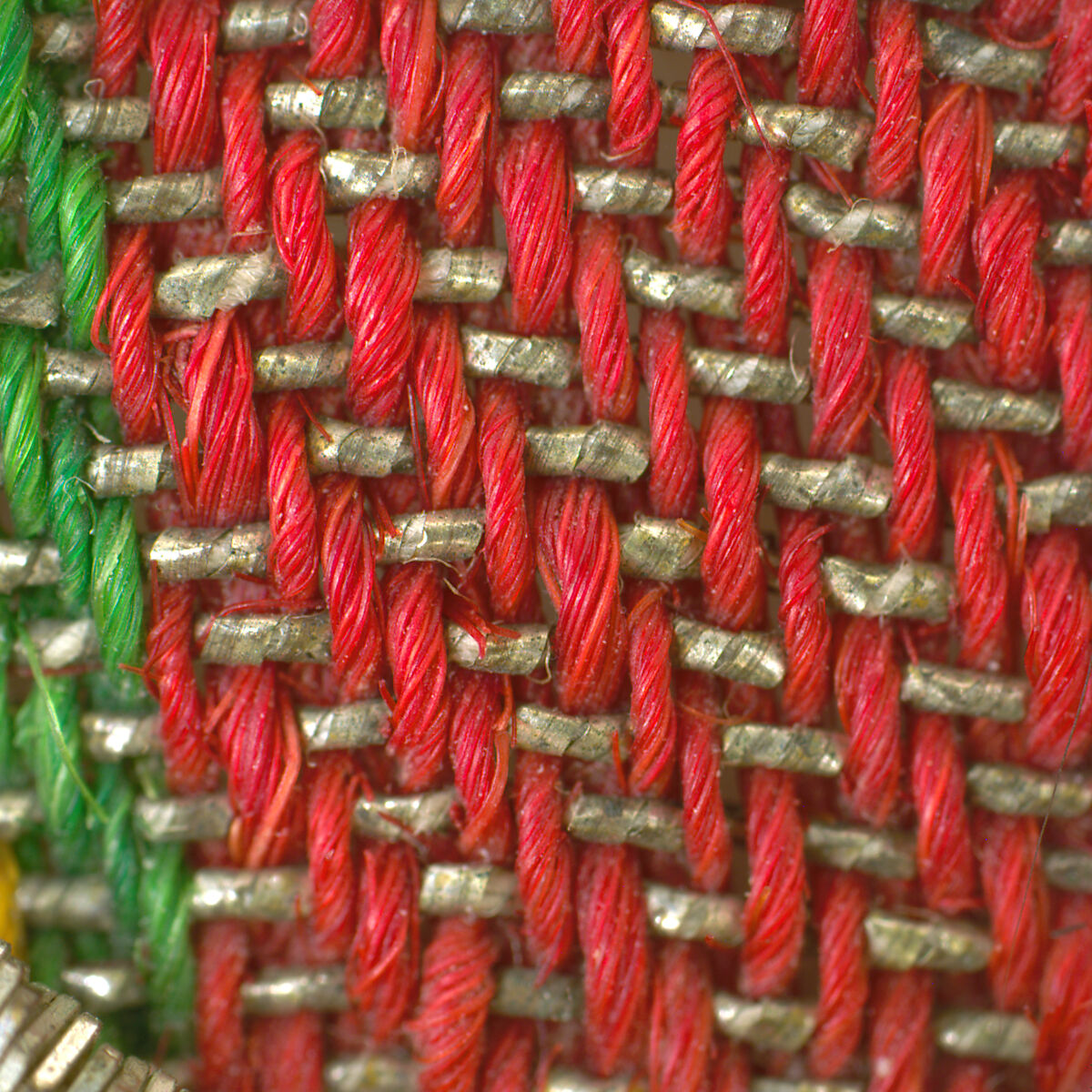 Fragment from an apron (opreg cu ciucuri), Background: twill weave (warp: Turcana wool, Z spun, 24 per cm; weft: metal-wrapped thread; wool, Z spun, 14 per cm; cotton, 2Z spun, S plied); decorative panel: tapestry weave (warp: cotton, 2Z spun, S pliz, 16 per cm; weft: linen, Z spun, 38 per cm; silk, 2Z spun, S plied; metal-wrapped thread, 64 per cm); embroidery: metal-wrapped thread, metal coil, Romanian, Banat area