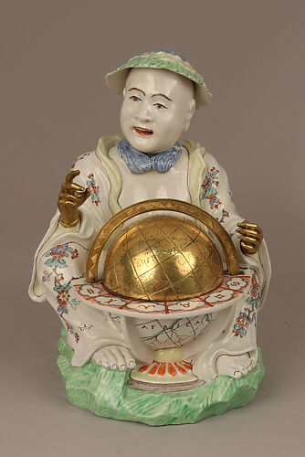 Pair of seated figures with globes