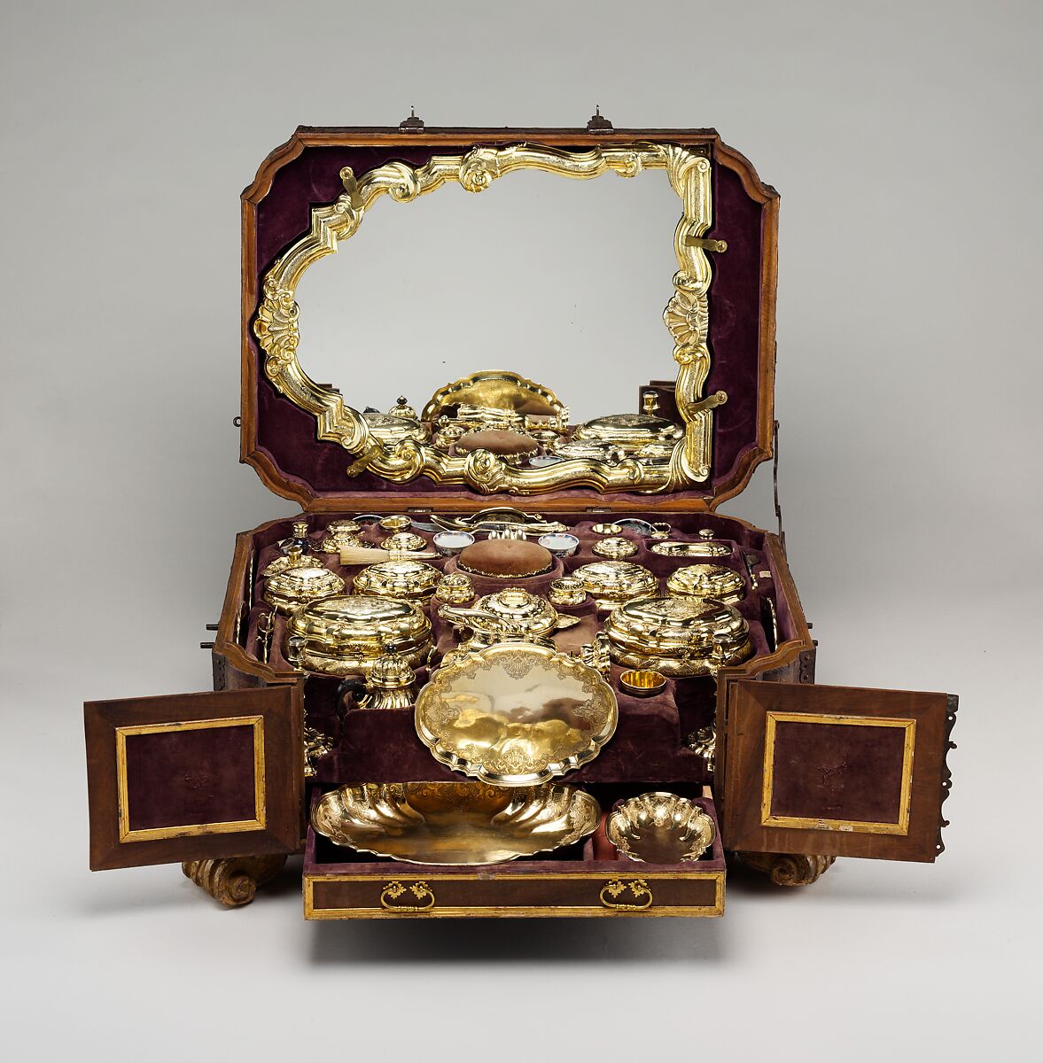 Toilet set in original leather case, Fourteen identified German (Augsburg) goldsmiths and other German artisans; Japanese (Imari) porcelain maker, Gilt silver, hard-paste porcelain, cut glass, walnut, carved and partially gilt coniferous wood, blind-tooled and partially gilt leather, partially gilt steel and iron, textiles, moiré paper, hog's bristle, German, Augsburg 