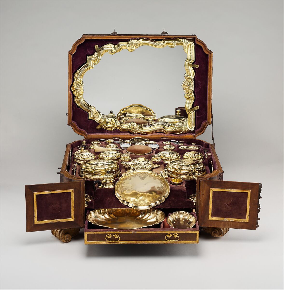 Toilet set in original leather case, Fourteen identified German (Augsburg) goldsmiths and other German artisans; Japanese (Imari) porcelain maker, Gilt silver, hard-paste porcelain, cut glass, walnut, carved and partially gilt coniferous wood, blind-tooled and partially gilt leather, partially gilt steel and iron, textiles, moiré paper, hog's bristle, German, Augsburg