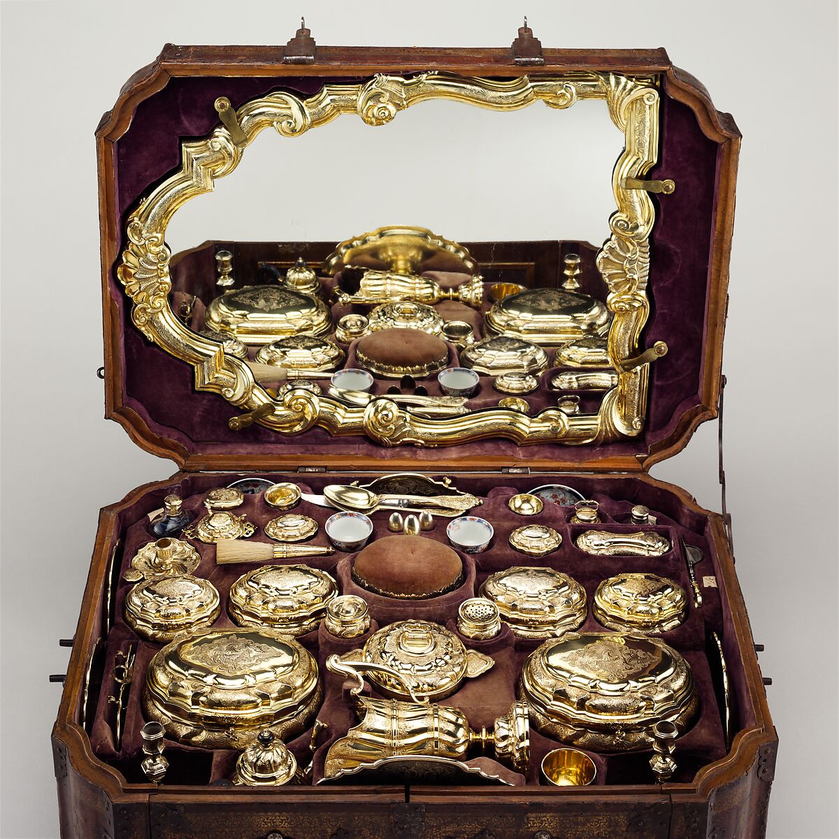 Toilet set in original leather case, Fourteen identified German (Augsburg) goldsmiths and other German artisans; Japanese (Imari) porcelain maker, Gilt silver, hard-paste porcelain, cut glass, walnut, carved and partially gilt coniferous wood, blind-tooled and partially gilt leather, partially gilt steel and iron, textiles, moiré paper, hog's bristle, German, Augsburg