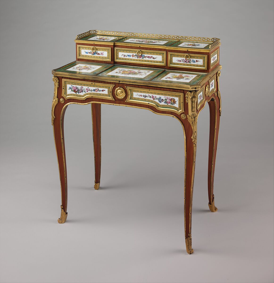 Small writing desk (bonheur-du-jour), Martin Carlin  French, Oak veneered with tulipwood, amaranth, and stained sycamore; mahogany; seventeen soft-paste porcelain plaques; gilt-bronze mounts; velvet (not original), French, Paris and Sèvres