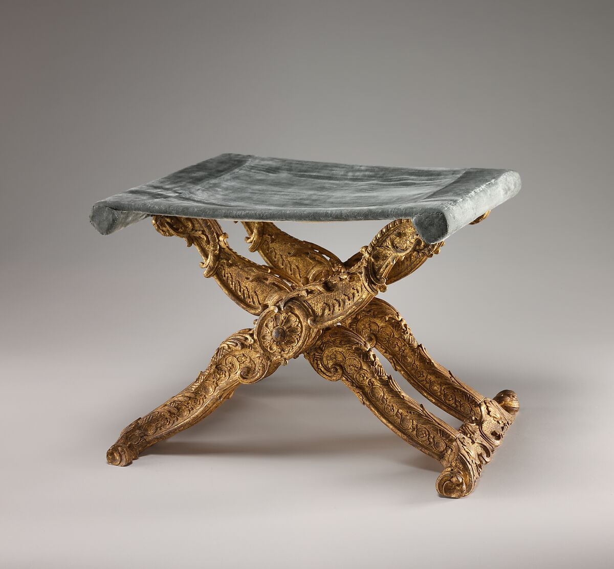 Folding stool (pliant) (one of a pair), Carved and gilded walnut; silk velvet with gold trim (not original), French, Paris