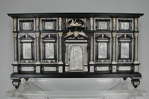 Collector's Cabinet, Workshop of Iacopo Fiamengo (Italian, active 1594 –1602), Ebony, African blackwood, ebonized wood; ivory (engraved and carved) and bone; case: coniferous wood; drawers: beech, coniferous wood, walnut; knobs, lock, hinges: gilt iron with modern bronze paint Primary woods and materials: ebony, African blackwood, ebonized wood (veneer applied to the back); ivory (engraved and carved); bone (stringing)Drawer knobs, lock, hinges:  gilt iron with modern bronze paint Secondary woods: Case: coniferous wood Drawers: beech, coniferous wood, walnut; stained poplar and coniferous wood used for modern casings of locks , Italian, Naples 