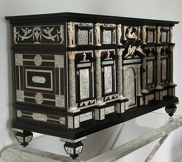 Collector's Cabinet, Workshop of Iacopo Fiamengo (Italian, active 1594 –1602), Ebony, African blackwood, ebonized wood; ivory (engraved and carved) and bone; case: coniferous wood; drawers: beech, coniferous wood, walnut; knobs, lock, hinges: gilt iron with modern bronze paint Primary woods and materials: ebony, African blackwood, ebonized wood (veneer applied to the back); ivory (engraved and carved); bone (stringing)Drawer knobs, lock, hinges:  gilt iron with modern bronze paint Secondary woods: Case: coniferous wood Drawers: beech, coniferous wood, walnut; stained poplar and coniferous wood used for modern casings of locks , Italian, Naples