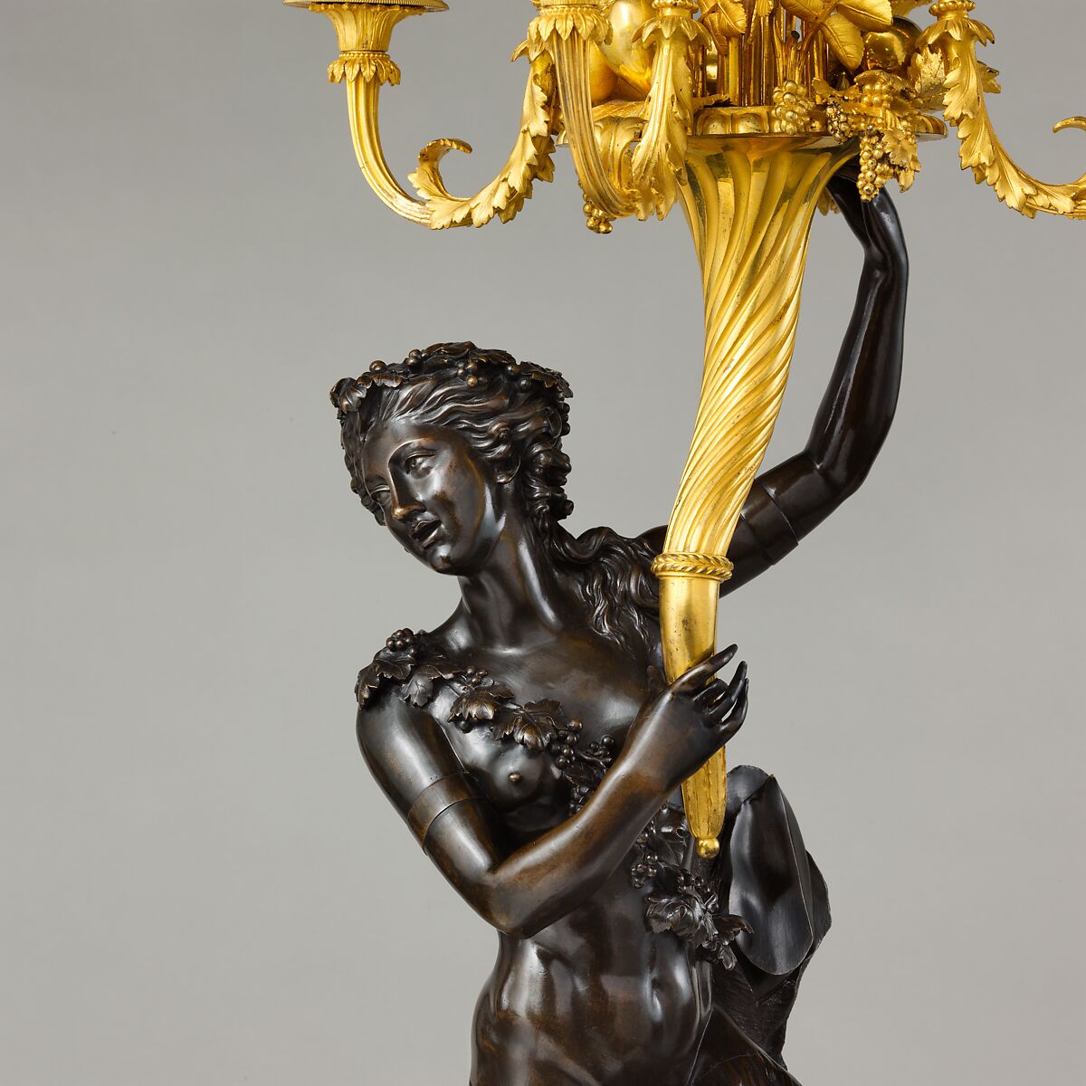 Five-light candelabrum (one of a pair), derives from a model by Clodion (Claude Michel) (French, Nancy 1738–1814 Paris), Gilt and patinated bronze, serpentine marble, French