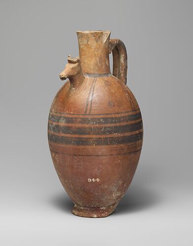Terracotta jug with horse's head in relief
