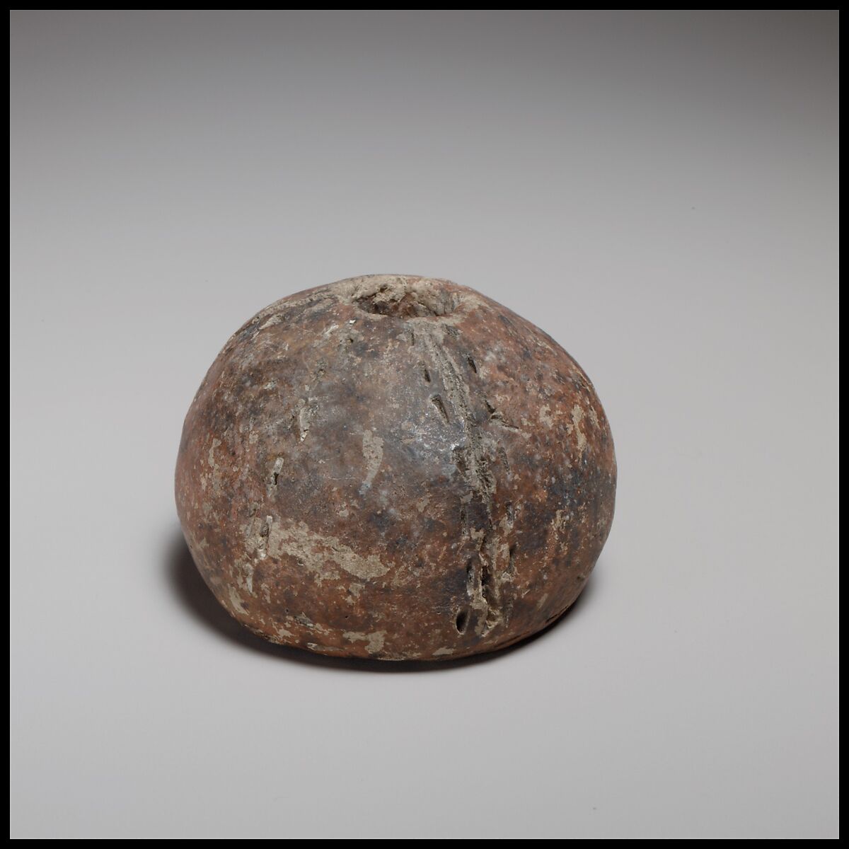 Spherical spindle-whorl with flat base, Terracotta, Cypriot 