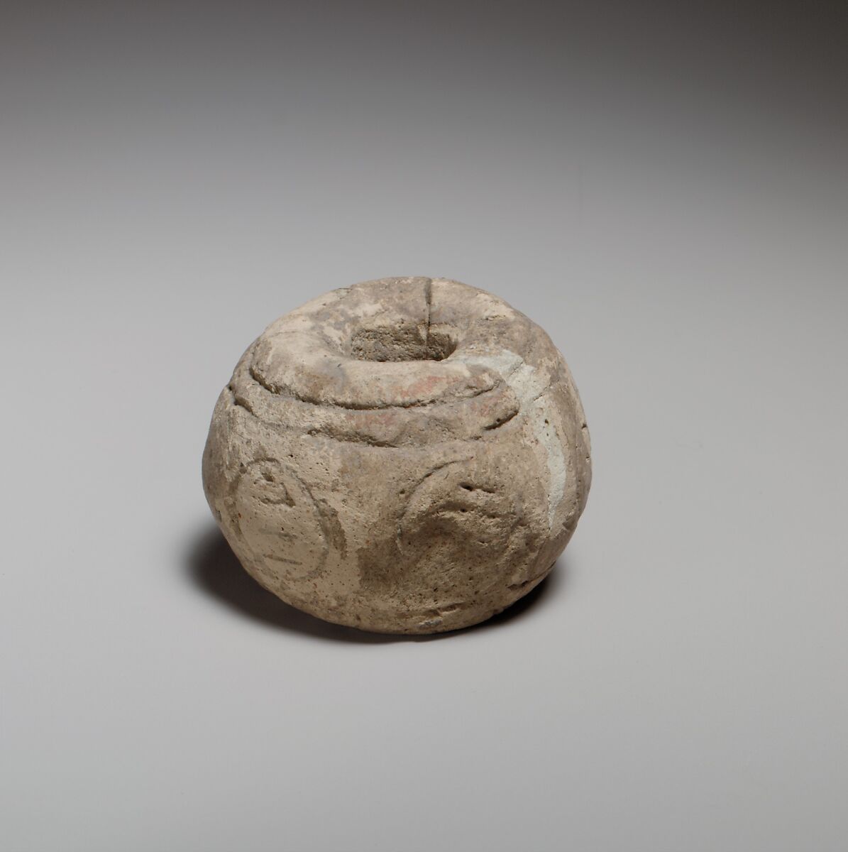 Spherical spindle-whorl with broad top and base, Terracotta, Cypriot 