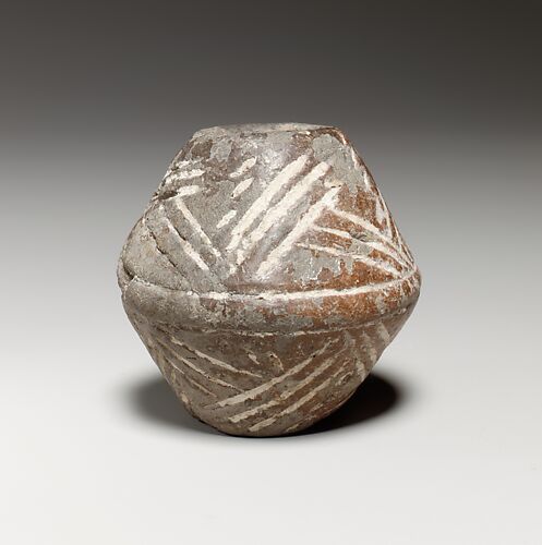 Terracotta biconical spindle-whorl with flat top
