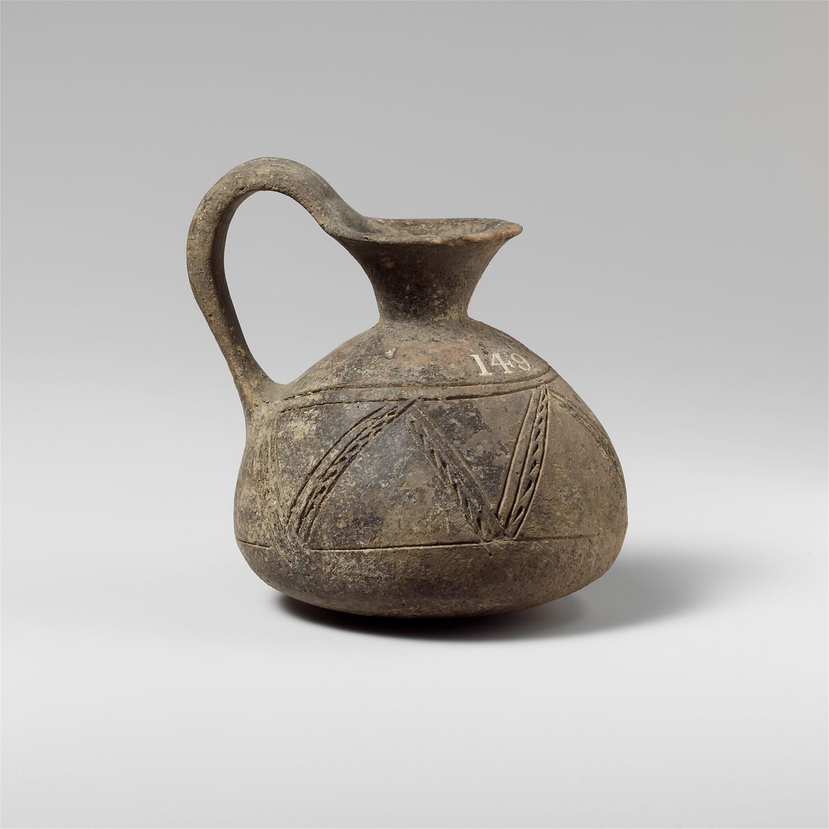 Terracotta jug with incised decoration, Terracotta, Cypriot 