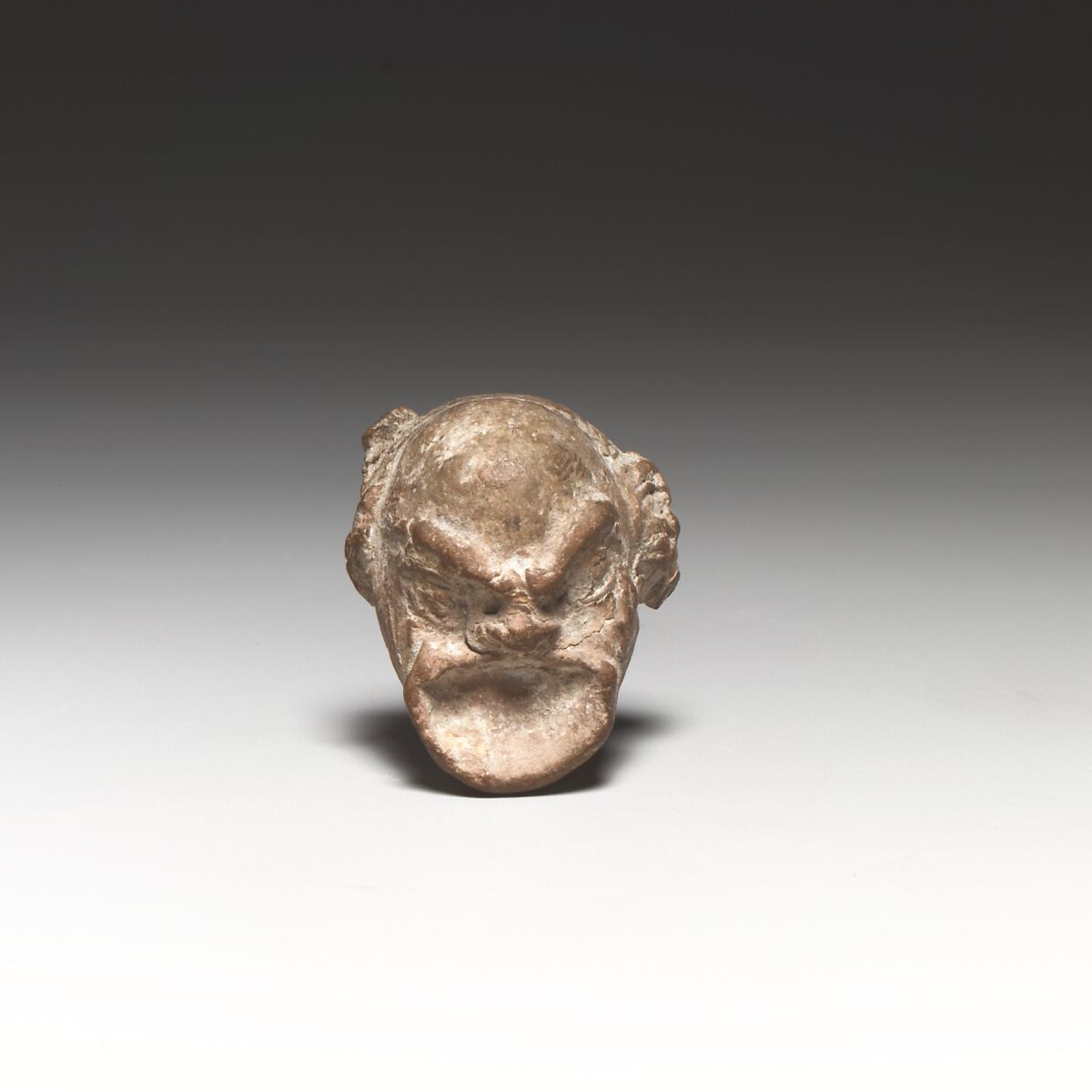 Head of a comic figurine, Terracotta, Greek, Rhodian ? 