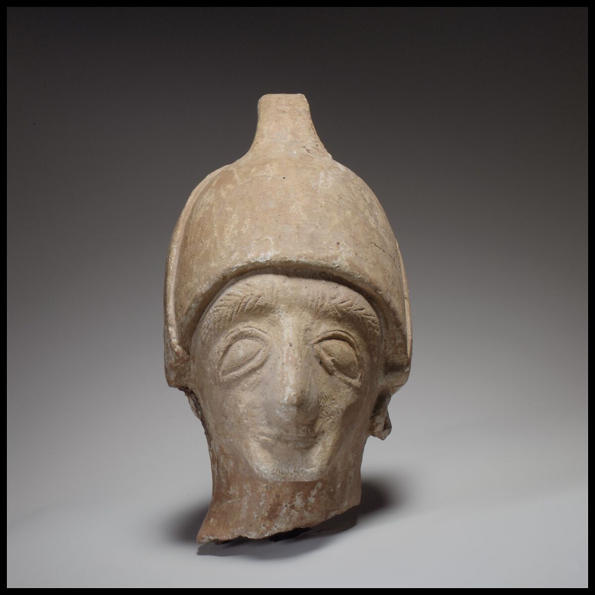 Male head wearing a helmet, Terracotta, Cypriot 