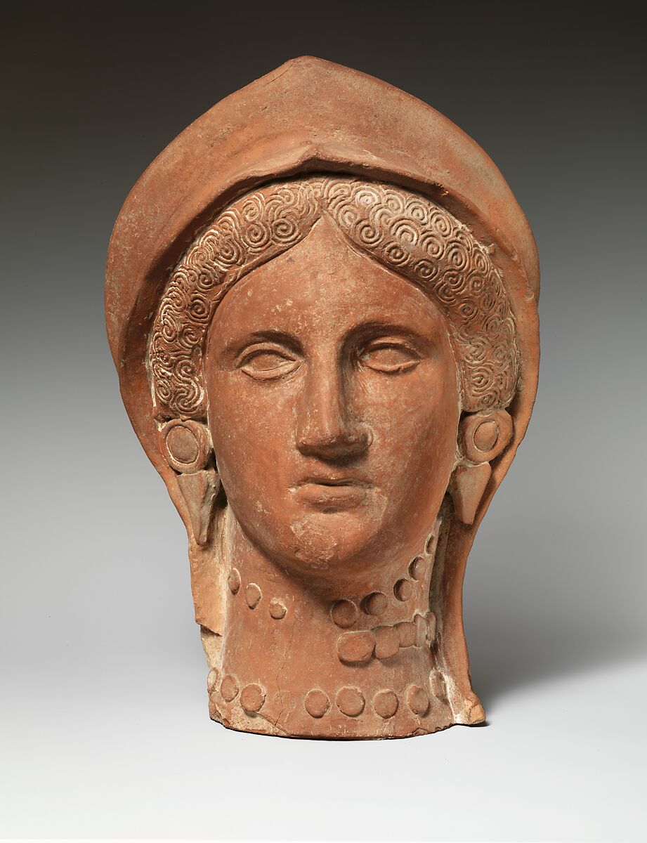 Terracotta head of a woman wearing a stephane Cypriot Cypro