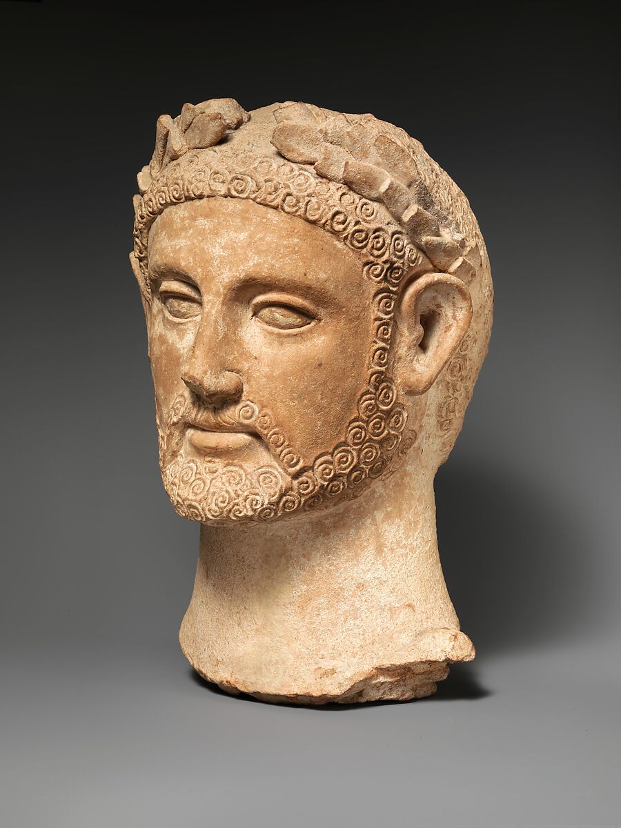 Terracotta head of a man wearing a wreath, Terracotta, Cypriot 