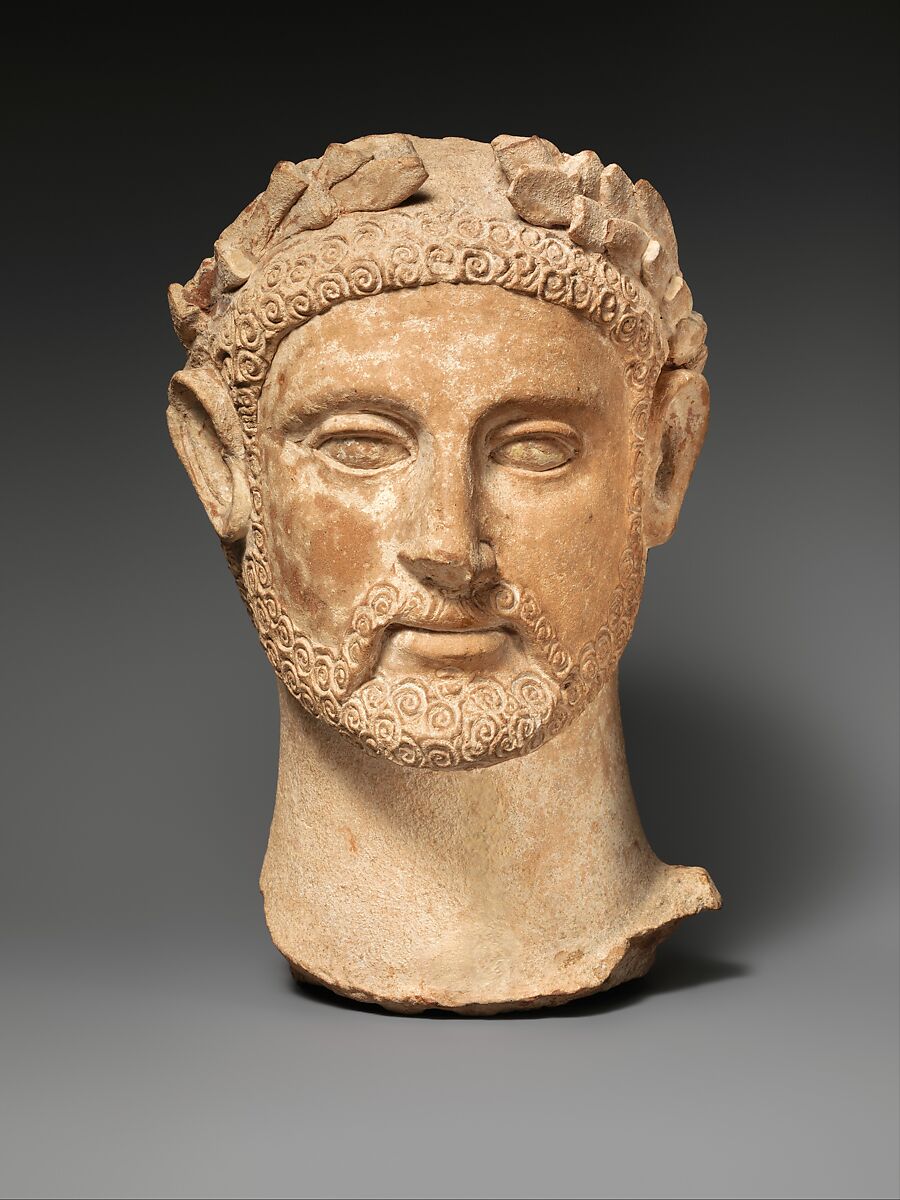 Terracotta head of a man wearing a wreath, Terracotta, Cypriot