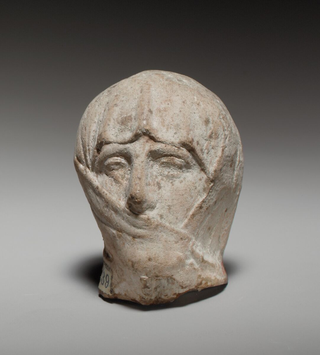 Terracotta head of a veiled woman, Terracotta, Greek 