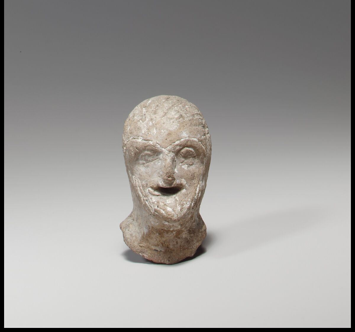 Head of a comic figurine, Terracotta, Cypriot 