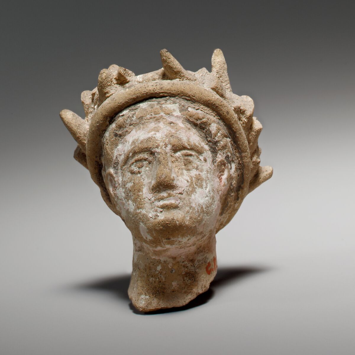 Terracotta male head wearing a wreath, Terracotta, Cypriot