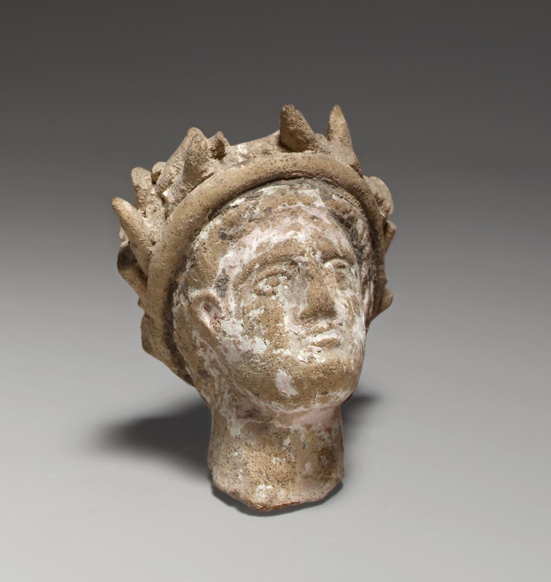 Terracotta male head wearing a wreath, Terracotta, Cypriot