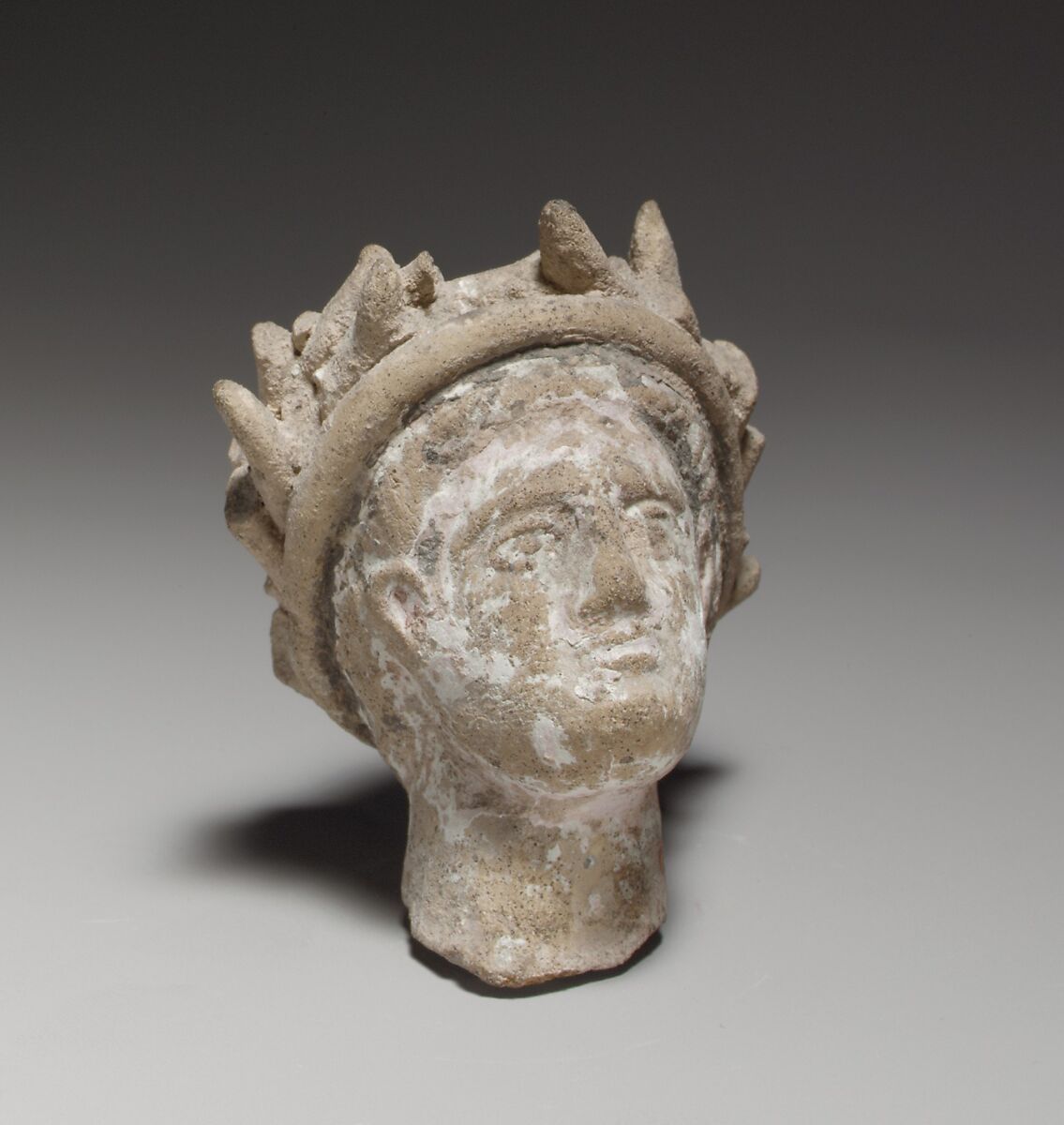 Terracotta male head wearing a wreath, Terracotta, Cypriot