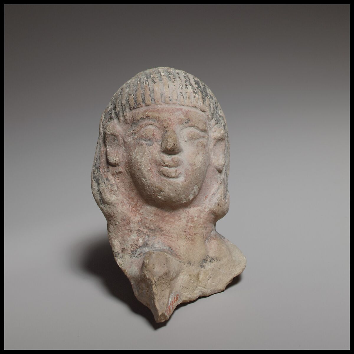 Female head, perhaps from a standing tambourine player, Terracotta, Cypriot