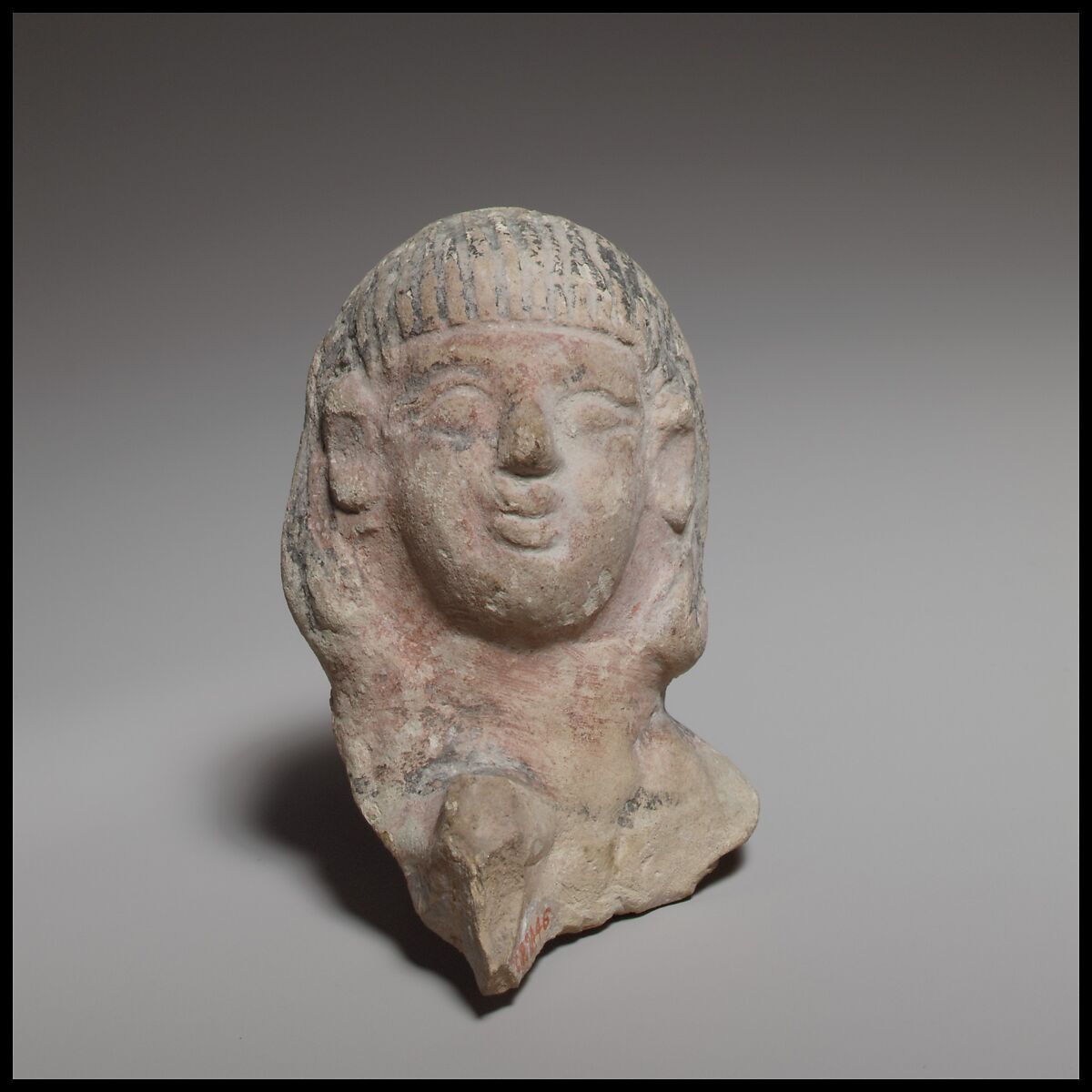 Female head, perhaps from a standing tambourine player, Terracotta, Cypriot 