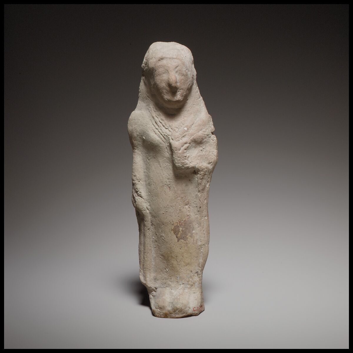 Standing female figurine holding a flower, Terracotta, Cypriot 