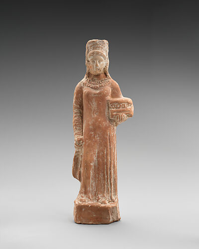 Terracotta figurine of a standing female votary holding a box