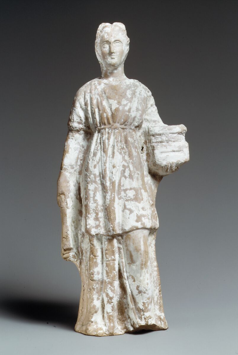 Terracotta figurine of a standing female votary holding a casket, Terracotta, Cypriot