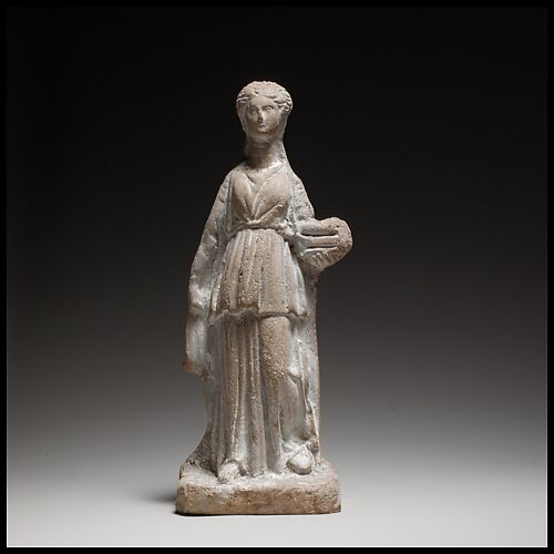 Terracotta figuring of a standing female votary holding a box