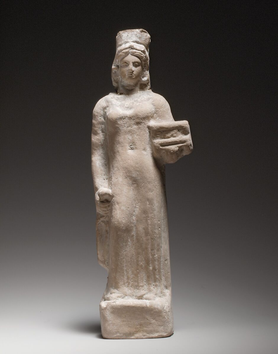 Terracotta figurine of a standing female votary holding a box, Terracotta, Cypriot 
