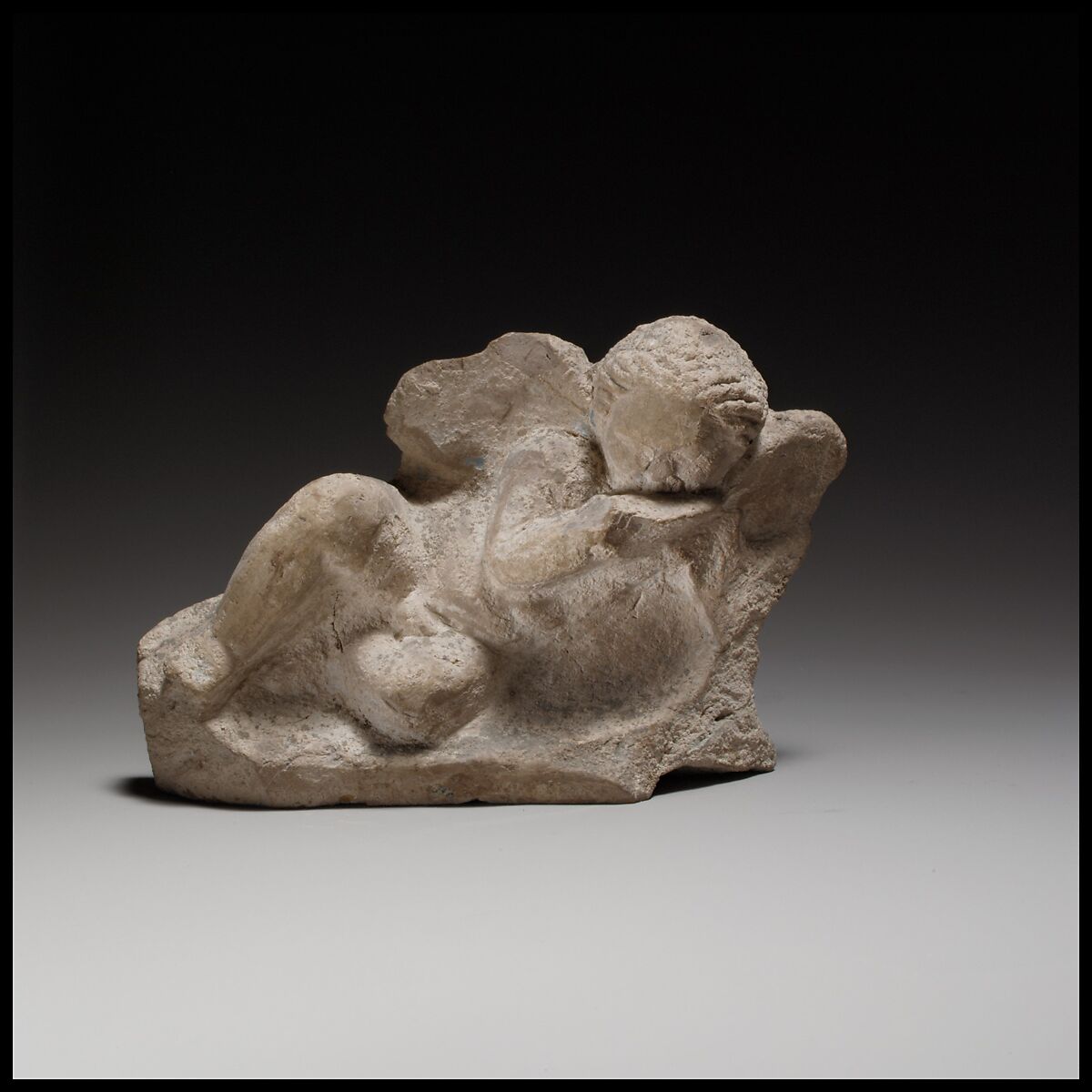 Terracotta statuette of Eros banqueting, Terracotta, Cypriot 