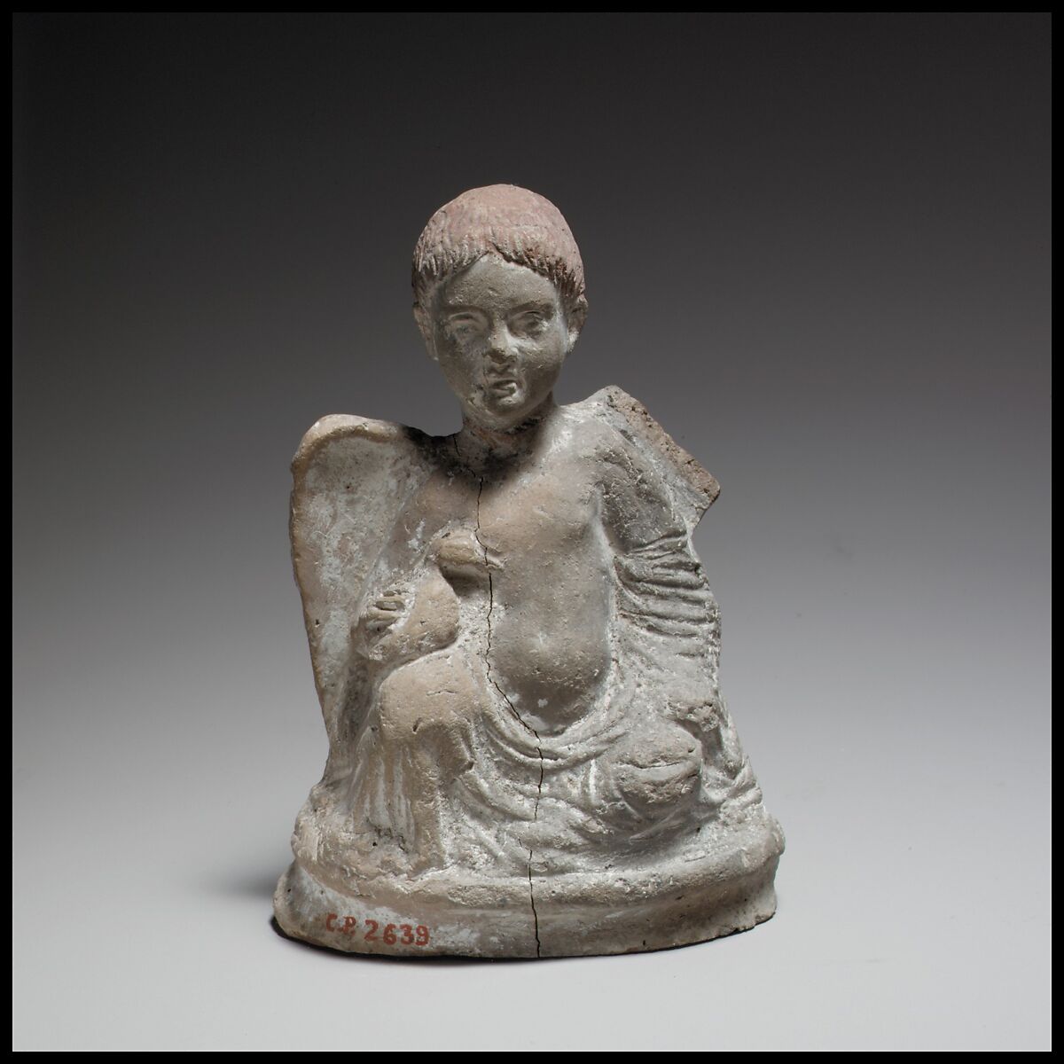 Terracotta statuette of Eros seated and holding a duck, Terracotta, Cypriot