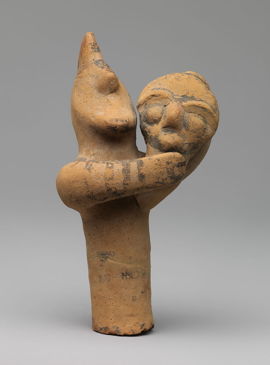 Terracotta statuette of a male figure holding the head and neck of a mask or image, Terracotta, Cypriot 
