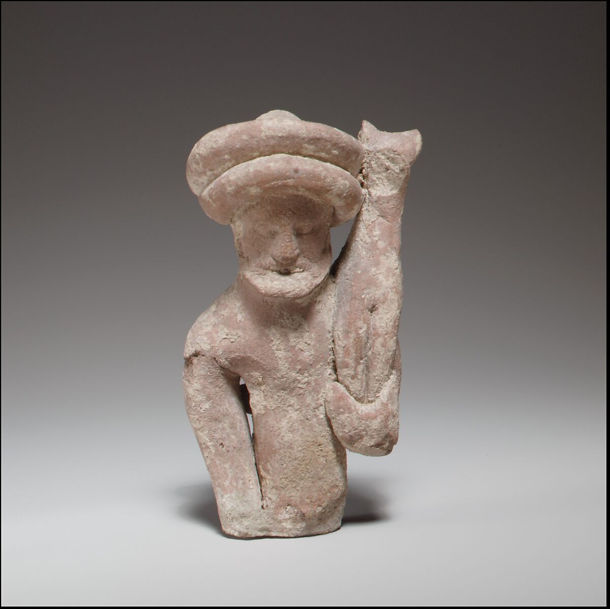 Terracotta statuette fragment of a male votary holding a kid, Terracotta, Cypriot 