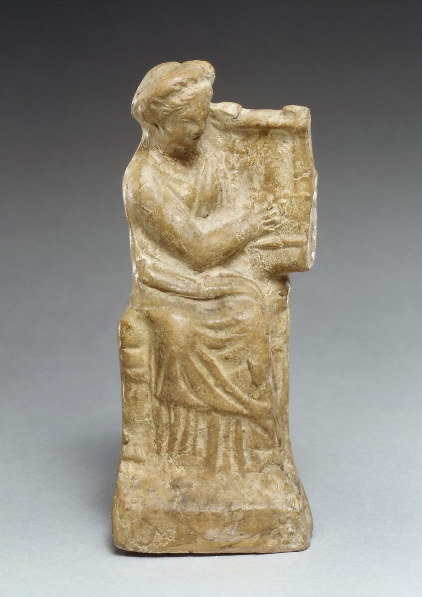 Terracotta statuette of a seated woman playing a kithera, Terracotta, Cypriot 