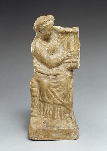 Terracotta statuette of a seated woman playing a kithera