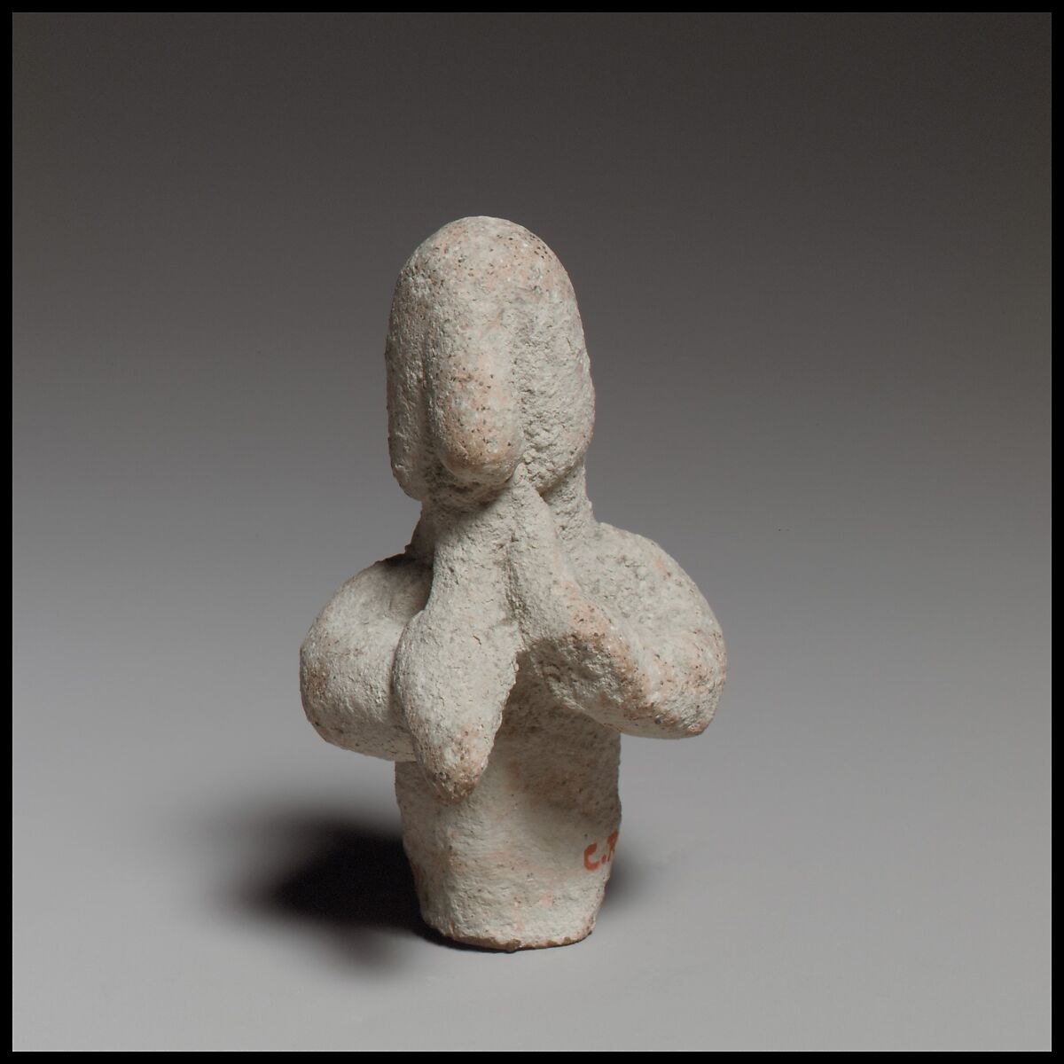 Statuette of a votary playing flute, Terracotta 