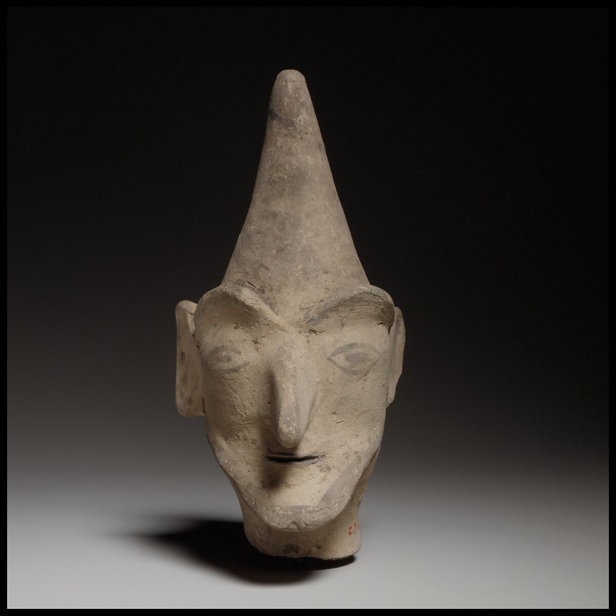 Male head wearing a helmet, Terracotta, Cypriot 