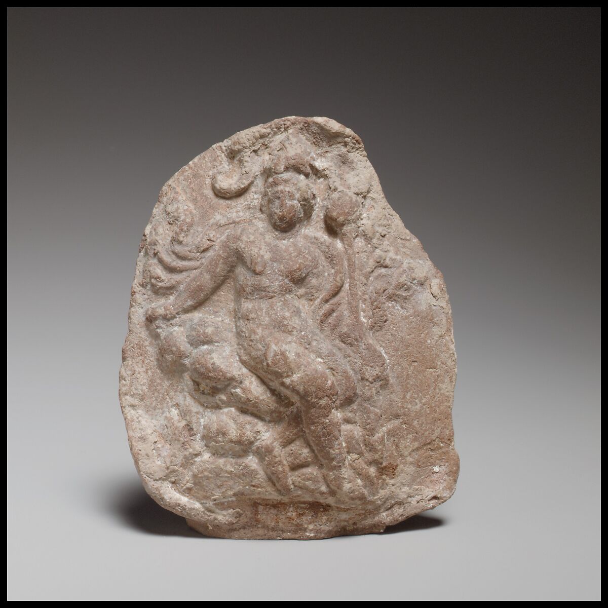 Relief depicting a seated figure, probably Dionysos, Terracotta, Cypriot 