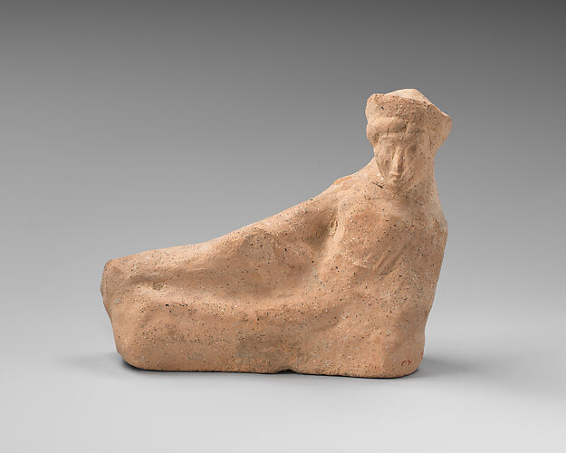 Terracotta statuette of a reclining youth