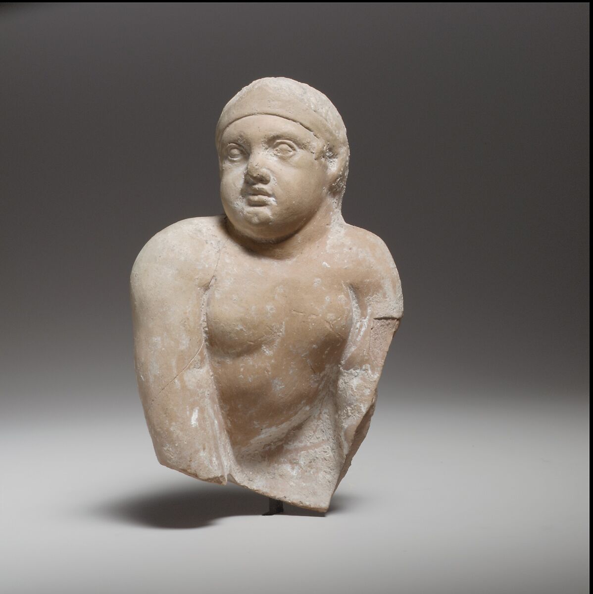 Terracotta statuette of a seated or crawling boy, Terracotta, Cypriot 