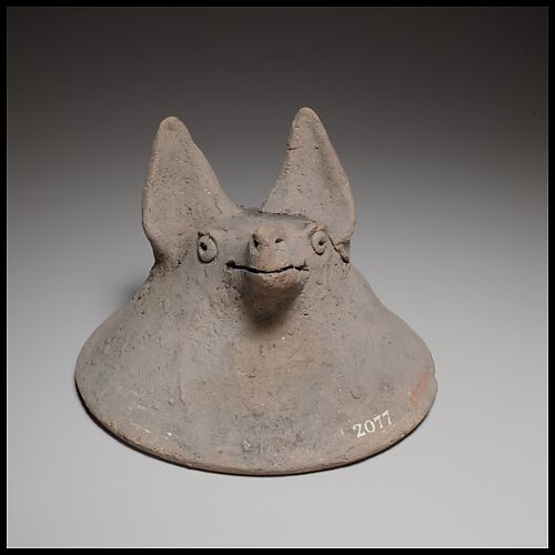 Terracotta mask in the shape of the head of a fox, dog, or bat