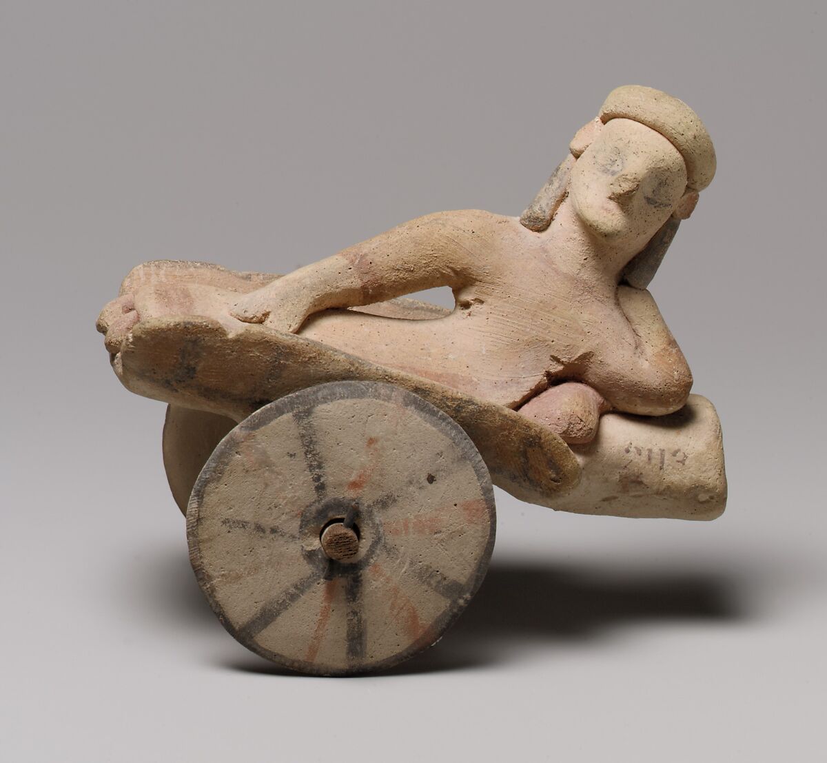 Model of a cart with a human figure, Terracotta, Cypriot 