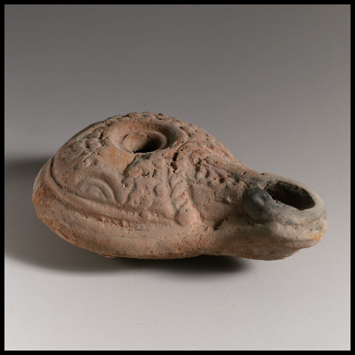 Terracotta oil lamp, Terracotta, Greek or Roman